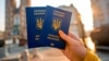 Generic – Hands holding Ukrainian abroad biometric passport