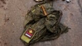 UKRAINE – Russian military uniform on the road in the village Dmytrivka in Kyiv region, which was liberated by the Armed Forces of Ukraine after destroying a convoy of Russian armored vehicles in this village, April 1, 2022