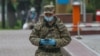 Kazakhstan. A military man walks along Almaty street, April 14, 2020